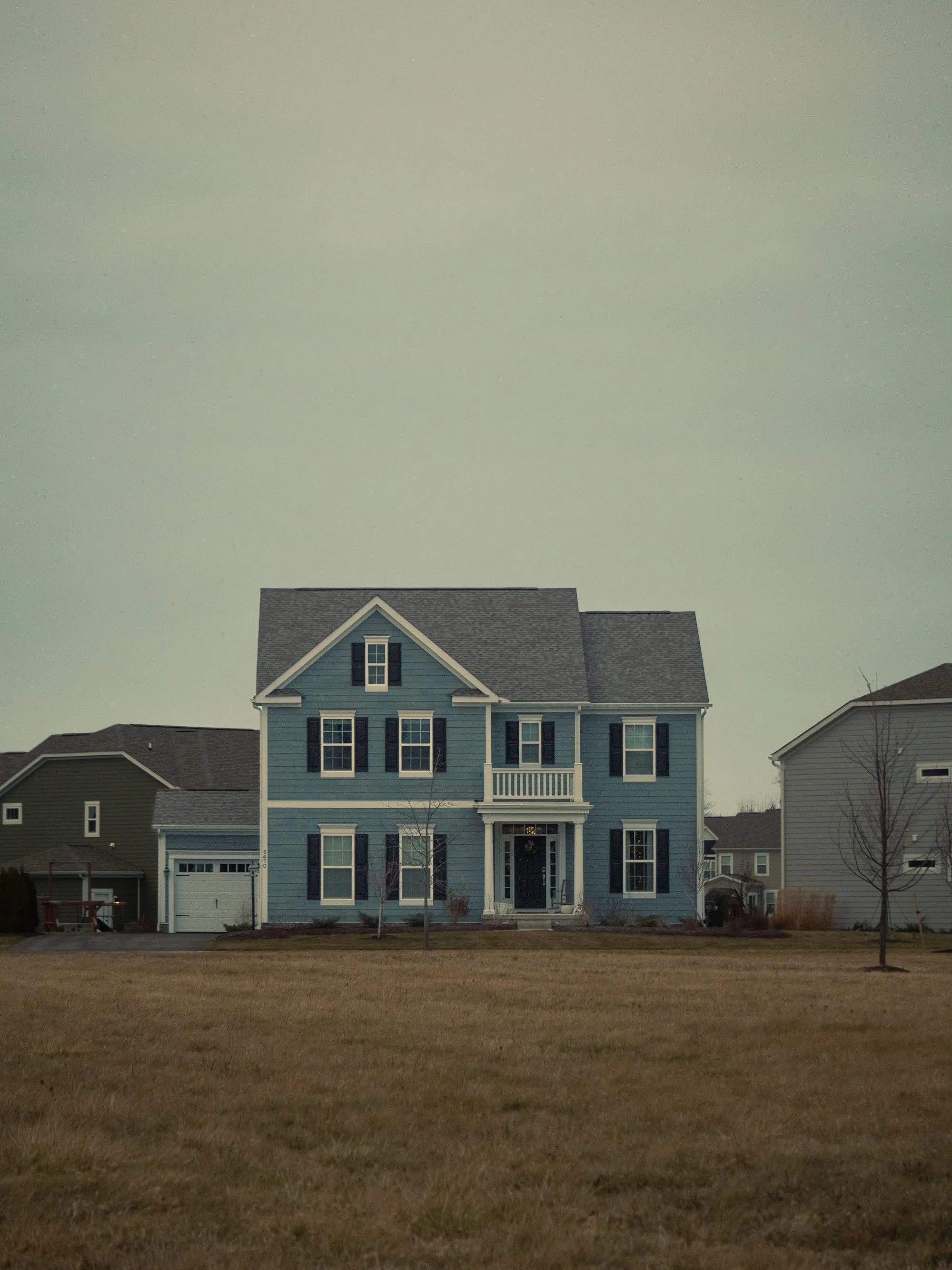 Two-story house with a wide front lawn